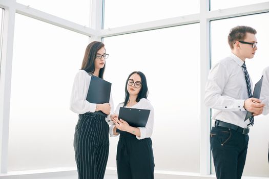 employees discussing the work plan before starting a business seminar. business concept
