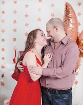 close up. portrait of happy parents on Christmas living room background