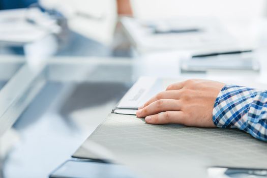 background image of a businessman sitting at his Desk. business background