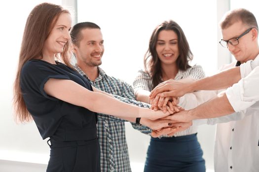 close up.business team showing their unity. start-up