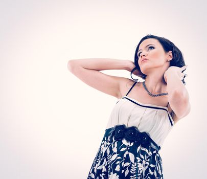 Happy young girl fashionista straightens his hair. Isolated on white background