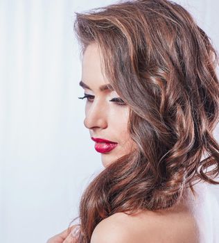 side view.portrait of a beautiful young woman. isolated on white background