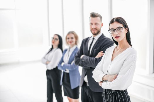 successful business woman standing in front of her business team.photo with copy space
