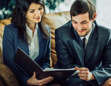 Image of business people listening and talking to their colleague at meeting