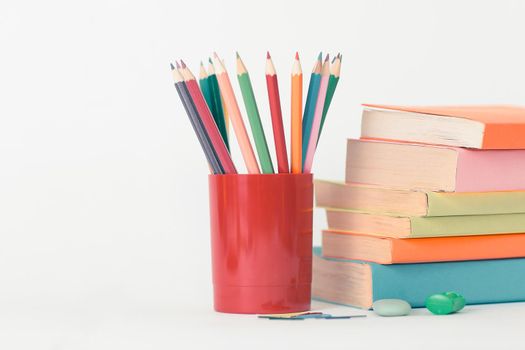 magnifier, paper clip and school supplies on white background .photo with copy space.