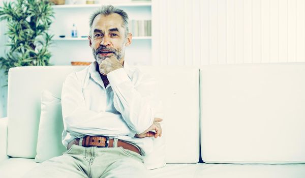 businessman on background of office. the photo has a empty space for your text