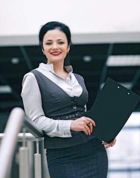 closeup of a young employee with documents .photo with copy space