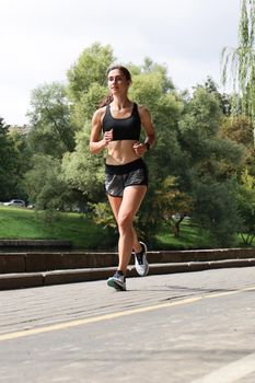 Young sport woman jogging in the park