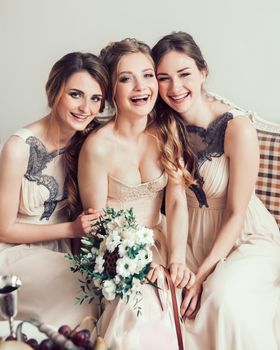 portrait of a happy bride with her two friends . photo with copy space