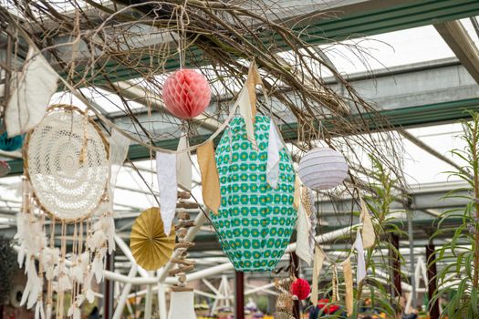 Paper lanterns and a dream catcher hang for decor