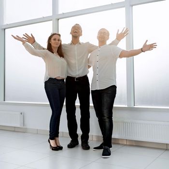 young business team standing in a bright office. photo with copy space