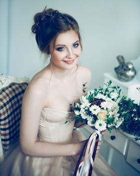 beautiful young woman bride with wedding bouquet. holidays and events