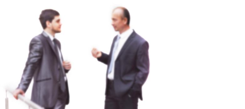 business colleagues discussing business issues. office weekdays. blurred image for the advertising text.