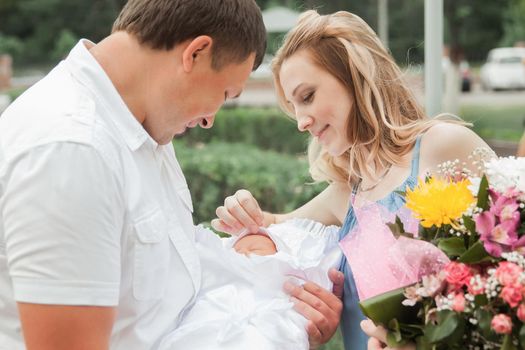 close up.happy young parents with newborn baby