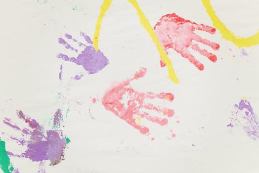 child colorful hand prints on white background