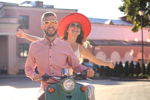 Young beautiful couple riding on motorbike. Adventure and vacations concept