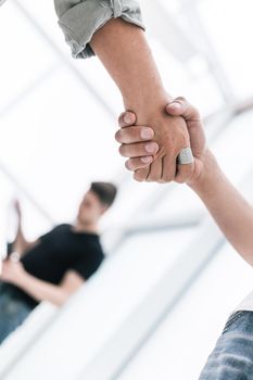 close up. handshake business partners on blurred office background . concept of cooperation