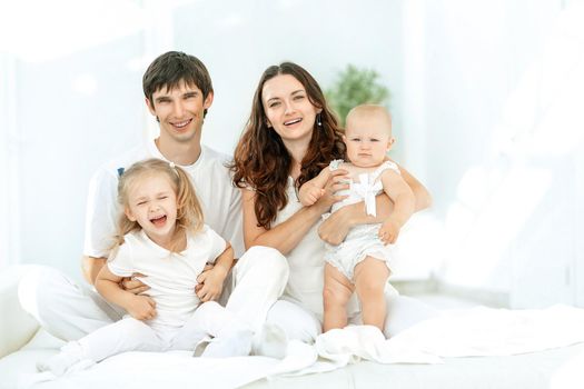 Happy family enjoying the morning in bed.photo with copy space