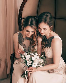 close up. bridesmaids looking at wedding bouquet. holidays and events