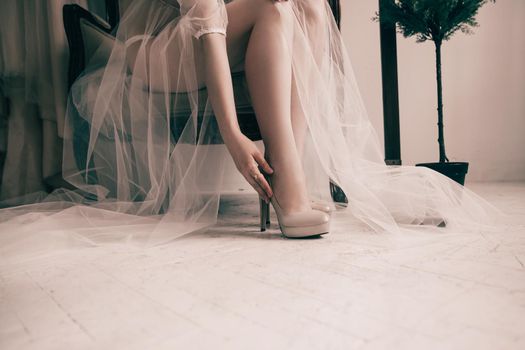 close up. bride trying on elegant wedding shoes. photo with copy space