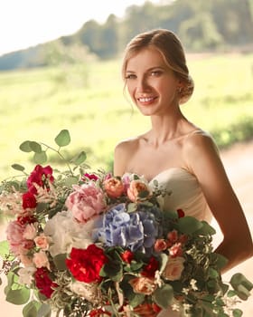 portrait of happy bride on blurred Park background . holidays and events