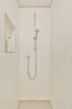 Elegant shower cubicle with wall opening for bathroom accessories