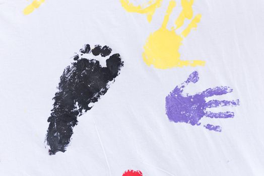 child colorful hands and foots print on white background