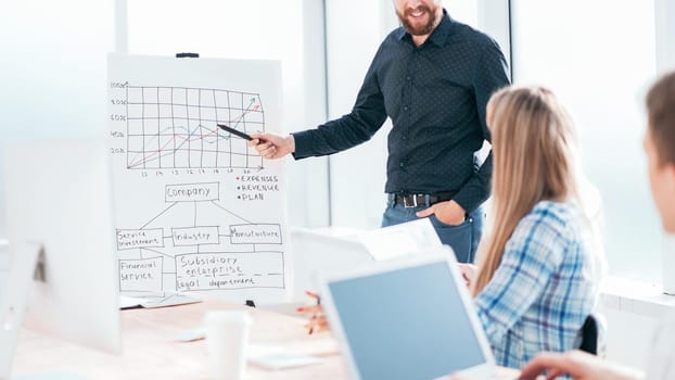 businessman pointing at graph during the business presentation. photo with copy space