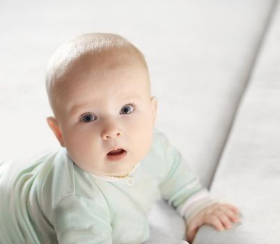 close-up of a pretty little baby looking at the camera.photo with copy space.