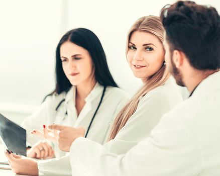 doctor radiologist discussing x-ray with her colleagues. the concept of health
