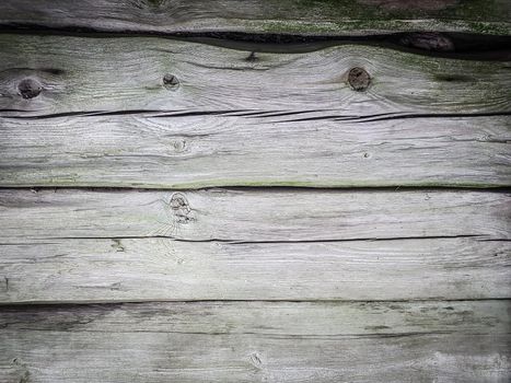 close up. a fragment of the wall of a wooden barn. background and texture
