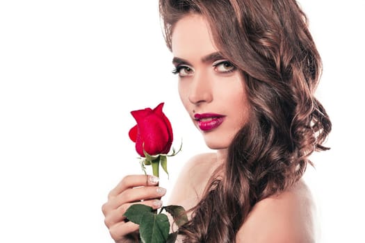 side view. stylish young woman with red rose . isolated on white background