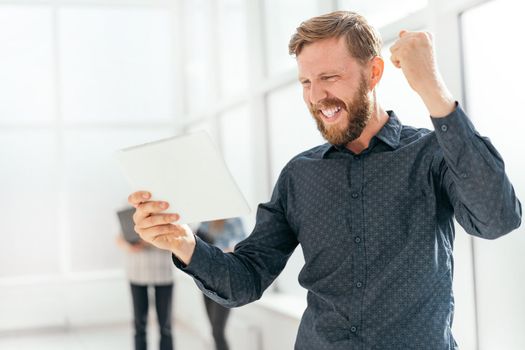 happy man getting good news on his email. photo with copy space