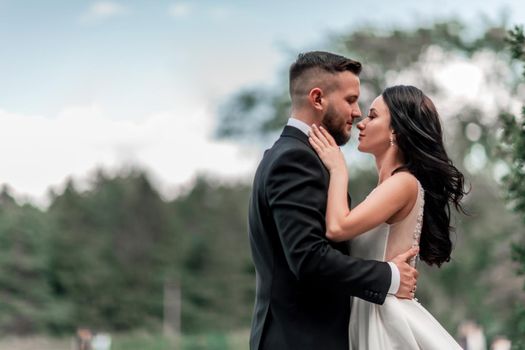 close up. bride and groom standing on the path in the Park. photo with copy space