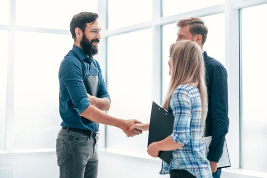 handshake business people in the office lobby . concept of cooperation