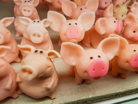close up. a lot of funny little pigs figurines with pink noses