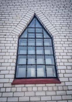 large window on the wall of the Catholic Church