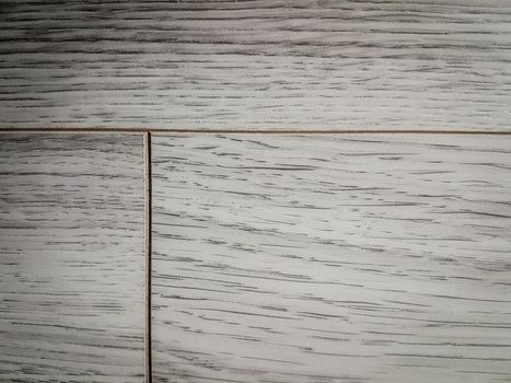 close up. fragment of white non-woven Wallpaper. background and texture