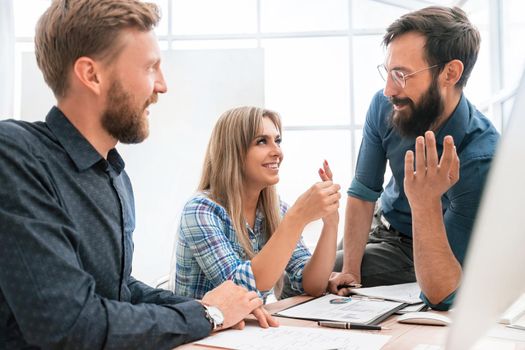 young employee to her colleagues explaining her ideas. the concept of teamwork