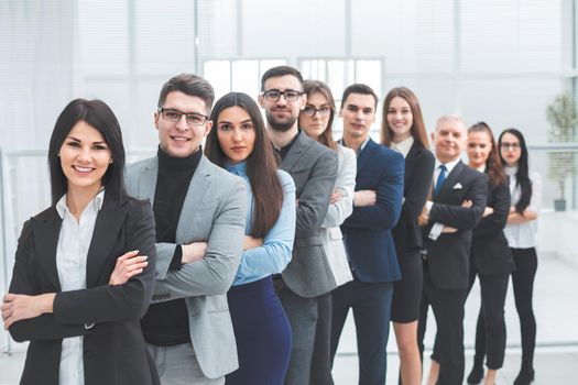 happy group of diverse young people standing in a row . the concept of teamwork