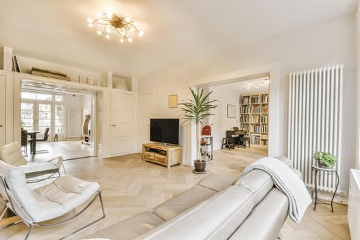 Large cozy living room with a large white sofa