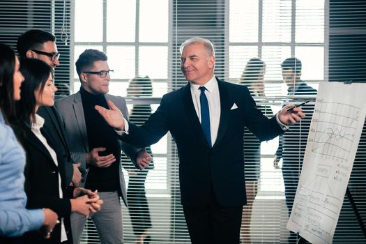 project Manager and working group standing in the conference room. start-up