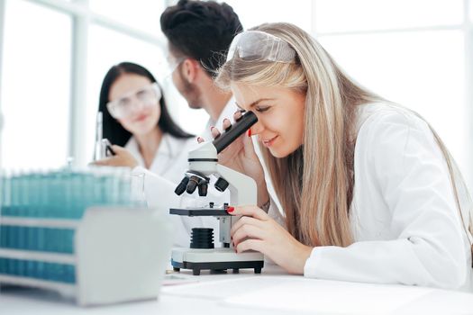 close up. a group of scientists conduct research in a modern laboratory. science and health