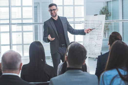 speaker is pointing at a flip chart during your business presentation. business and education