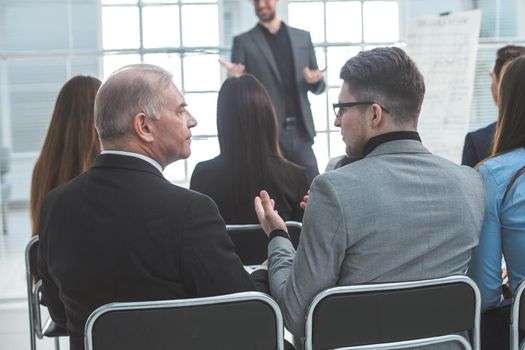 rear view. business people sitting in the conference room. business and education