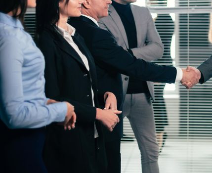 business partners shaking hands during the presentation. success concept