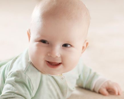 close up.portrait of a pretty little baby on blurred background.photo with copy space.