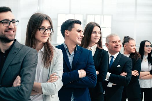 close up. professional team of business people standing together. the concept of teamwork