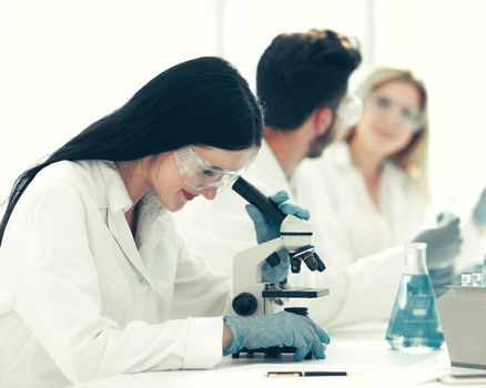 close up.scientists and laboratory workers sitting at the laboratory table. science and health