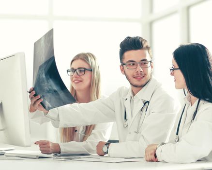 doctors experts discuss x-ray,sitting at the table .photo with copy space